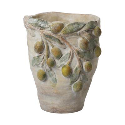 Zementvase mit Zitronen